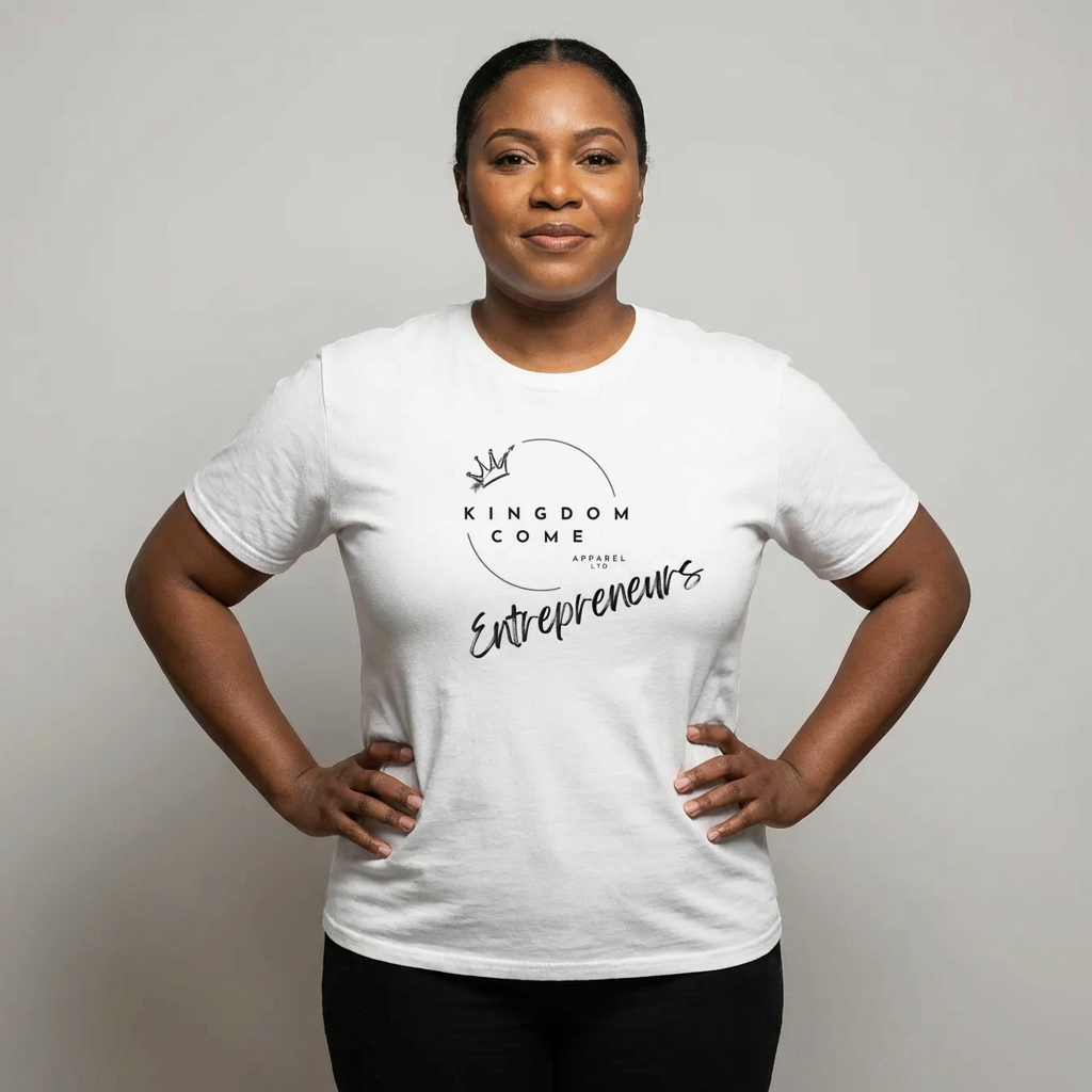 Person wearing a white t-shirt with 'Kingdom Come Apparel' branding on a plain background